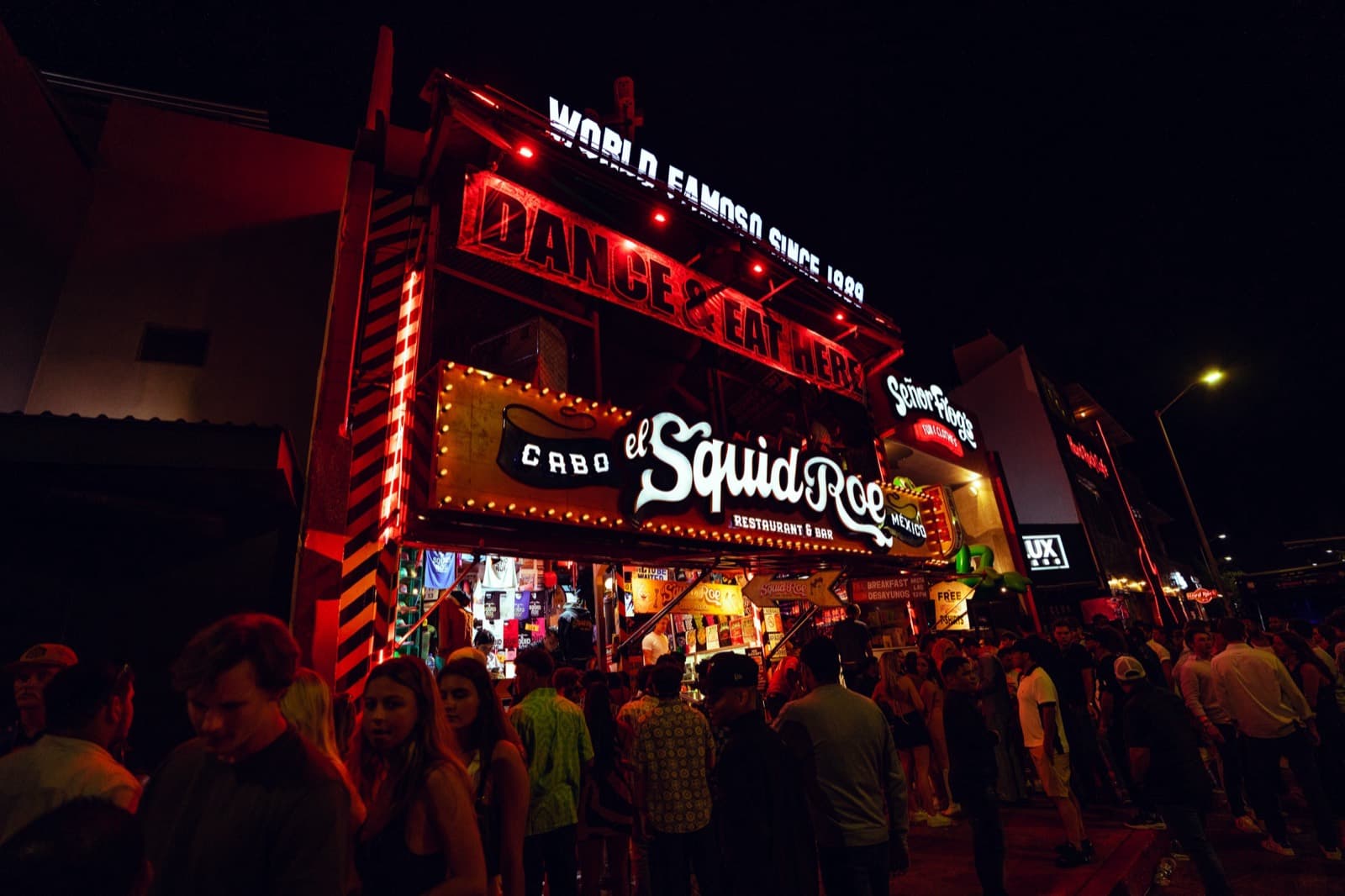 El Squid Roe facade lit up at night in downtown Cabo San Lucas — the meeting point where every Cabo Party Pass night begins